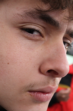A angled close up of student Kye looking at the camera