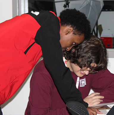 An image of students Abdullahi and Aiden collaborating